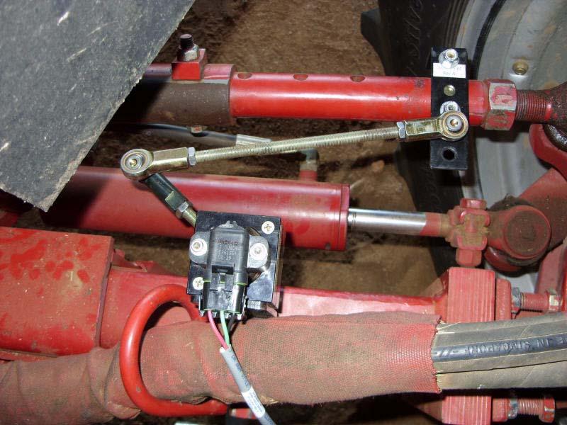 Attaching and Adjusting Wheel Angle Sensor Linkage Rods 10. Disconnect the linkage rods and turn the steering wheel manually to the full left position. 11.