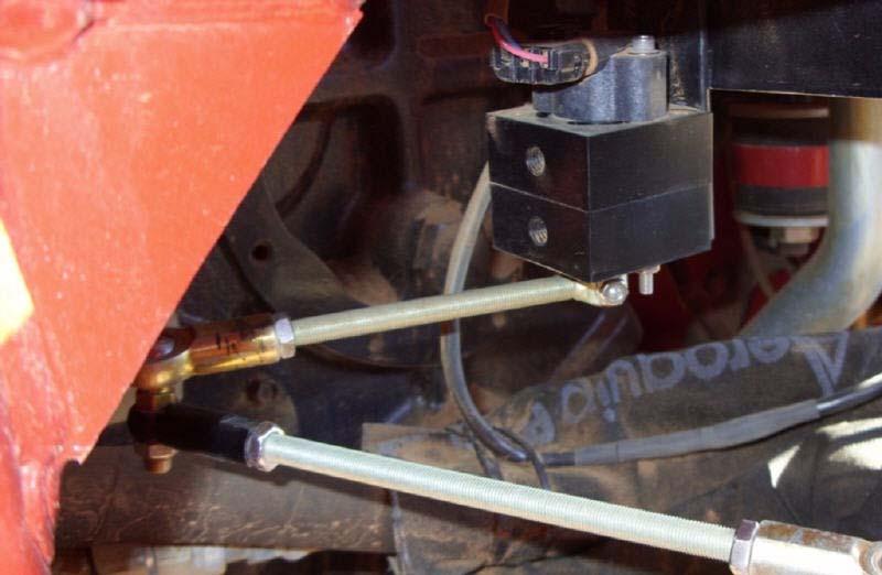 Attaching and Adjusting Wheel Angle Sensor Linkage Rods 13. Disconnect the linkage rods and turn the steering wheel manually to the full left position. 14.