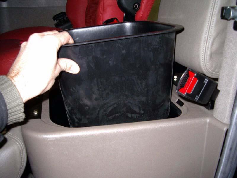 Installation Procedure 2. Remove the storage bucket from beneath the seat. See Figure 3-2. Note: Removing the storage bucket provides access from above to the large cab left hand side compartment.