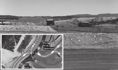 FEATURED ARTICLES Figure 6 Prototype Trials at Australian Test Site Photograph (1) shows a dump truck being positioned at a loading location specified by the excavator, (2) shows permission control