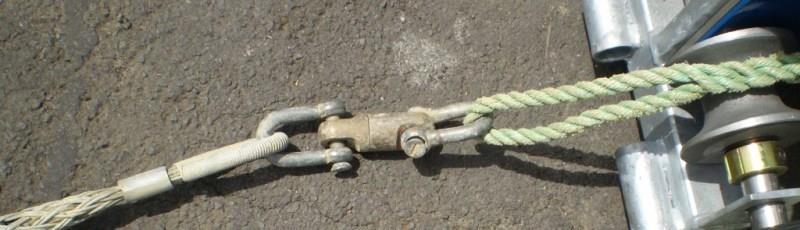 Attach swivel to end of rope with slot head shackles (do not use boat or marine shackles as they catch on obstructions in trench or duct.