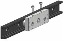 In case of more sliders in same rail, the misalignment of the fixing holes of various sliders is compensated by making a bit larger holes on the fixing structure.