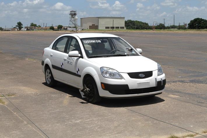 6.4 TEST DESCRIPTION Figure 6.2. Vehicle before Test No. 490025-4-2. The 2009 Kia Rio, traveling at a speed of 61.