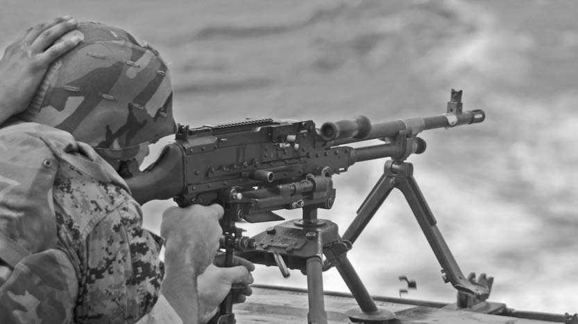 Navy). Below: The U.S. M240G, the U.S. Marine Corps standard 7.62mm machine gun.