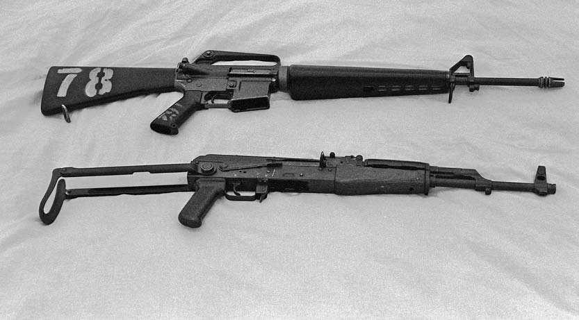Small Arms for Urban Combat 5.56mm M16A1 (top) compared to the 7.62mm AKMS. The flash hider on the M16 is the early pattern open prong type.