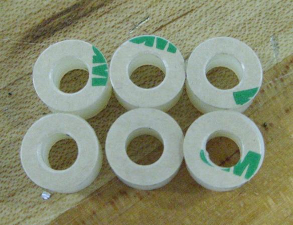21. Using six (6) adhesive discs (Part Number 9755) and six (6) spacers (Part Number F145813)