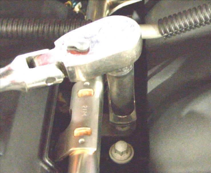 25. Reposition the fuel line bracket onto the stud and