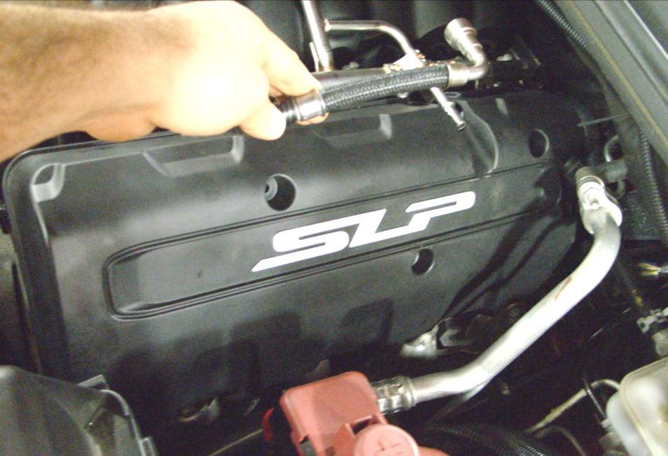 31. Position the fuel line so the coil cover can be installed without interference.