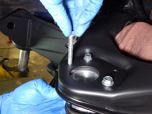 align the holes of the ball joint,