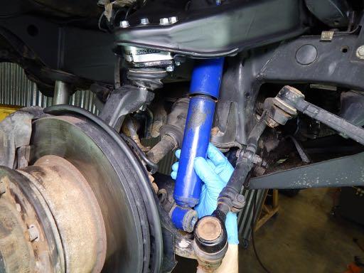 If you are REPLACING the shock absorber, follow the instructions that are supplied with the