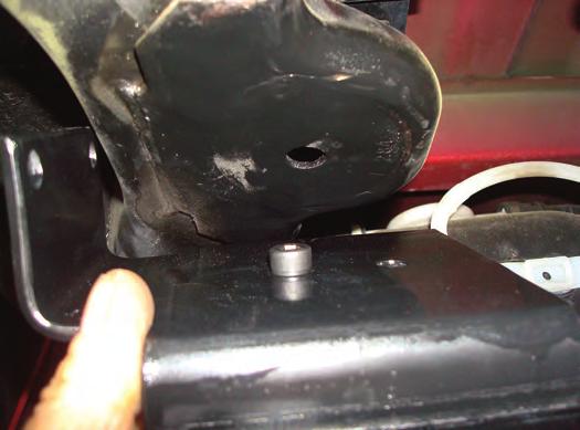 Insert the socket head bolt into the existing hole in the frame that was under the stock jounce bumper (fig.