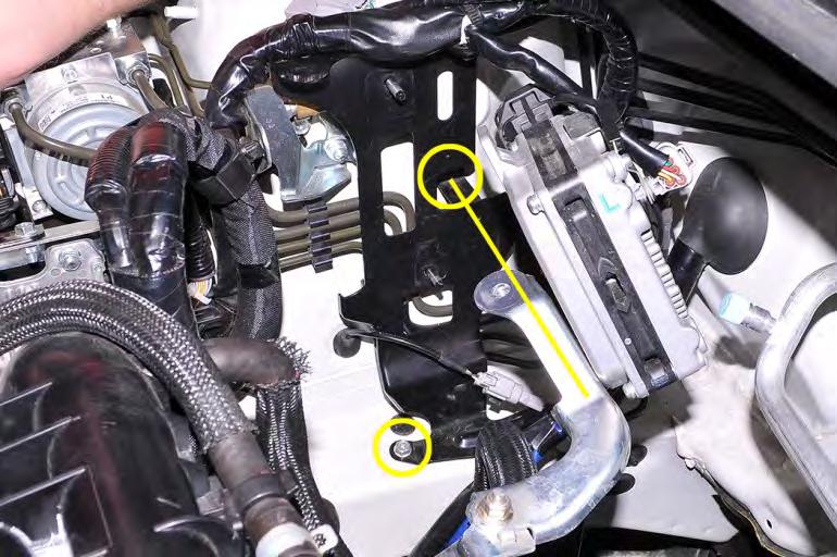 Remove the (2) 10mm bolts that hold the ECU bracket to the passenger side