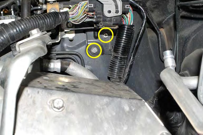 Remove main wiring harness bracket using a 10mm socket and ratchet, it is held