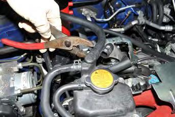 Do this fast so that coolant loss is kept to a minimum.