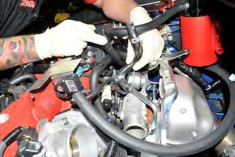Trim the line to fit onto the upper coolant turbocharger hard pipe.