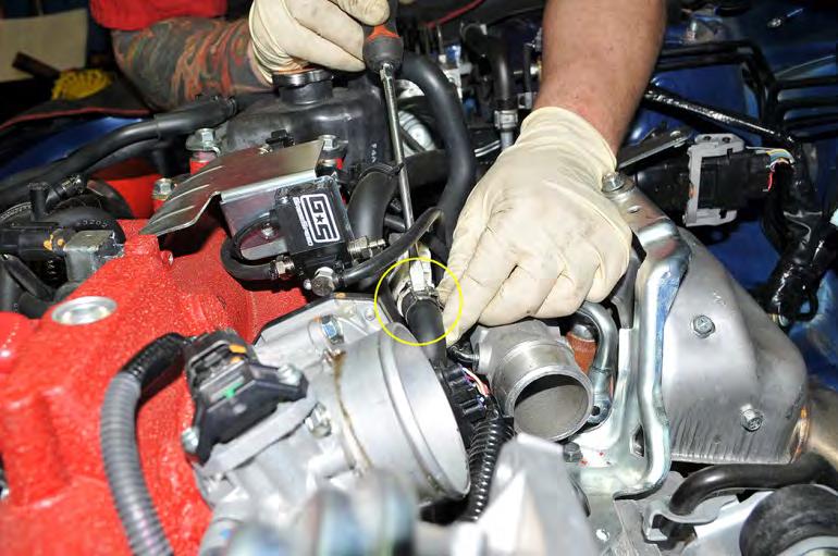 10. Remove the clamp from the OEM blow-by sensor located at the rear of the turbocharger