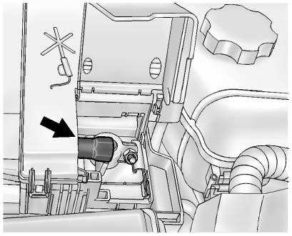 Lift the battery cover up toward the front of the vehicle to release it from the pivot points (2) and remove. 3. Reverse Steps 1 and 2 to reinstall the battery cover.