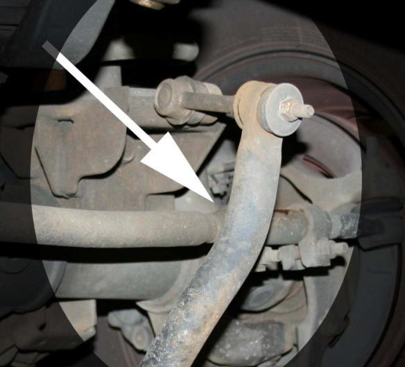 Remove the four mounting bolts (15mm) that secure the sway bar to the