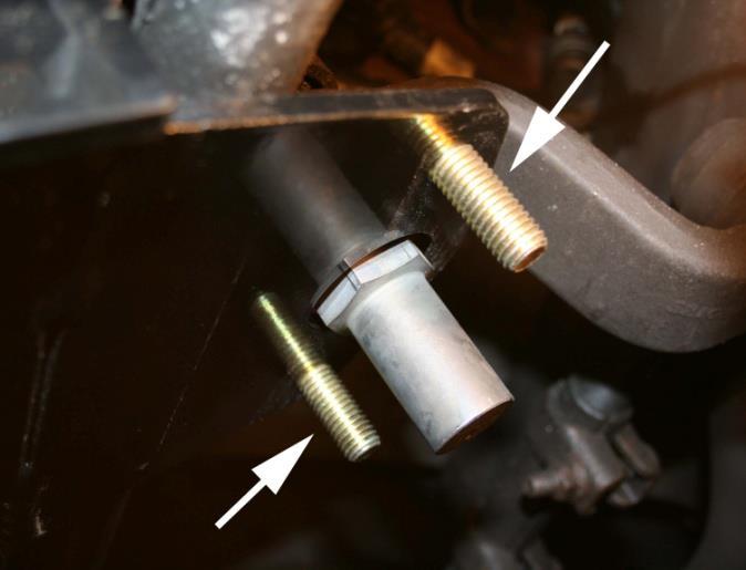 Install two bolts through the small holes in bearing mounting area, so that the threads are hanging through the bracket.