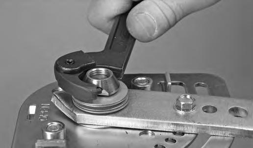 10. Using a spanner wrench, tighten the tamper-resistant