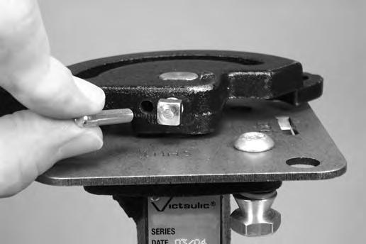 6. Insert the grooved drive pin (Item 3) into the hole in the tamperresistant handle, as shown above.