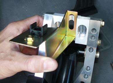 9. Make note of how and where the supplied brake light switch bracket is installed. Note the black plastic brake light switch bracket has been installed from Step 6. 10.