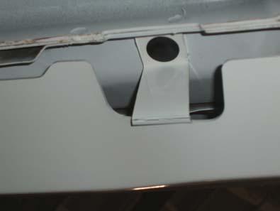 4. Install pushpins into bottom of front and rear rocker moldings. a. The forward most hole in the front rocker must be folded into place. (Figure E) (Figure E) b. Use the small push pin (Pin, 6.