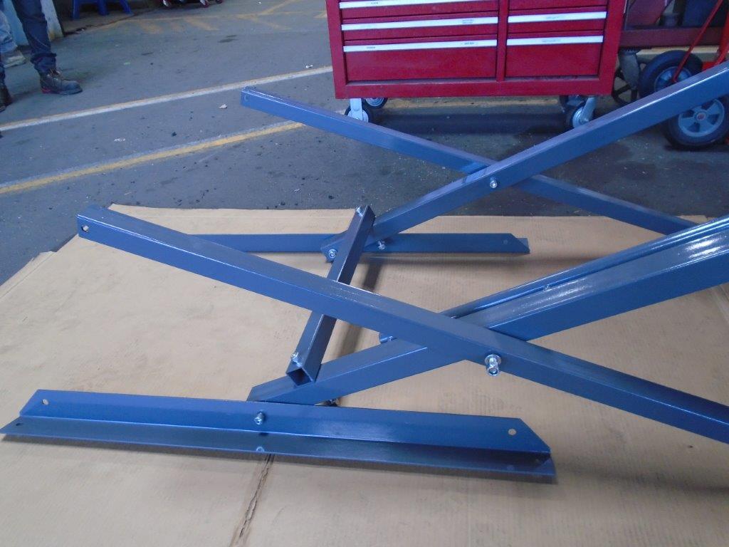 Bolt the base frame legs to the vertical support bars.