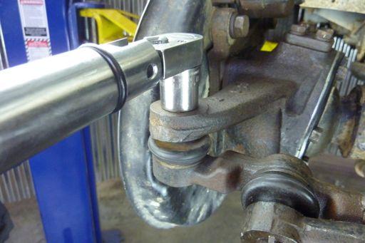 with the holes in the tie rod stud, install a new