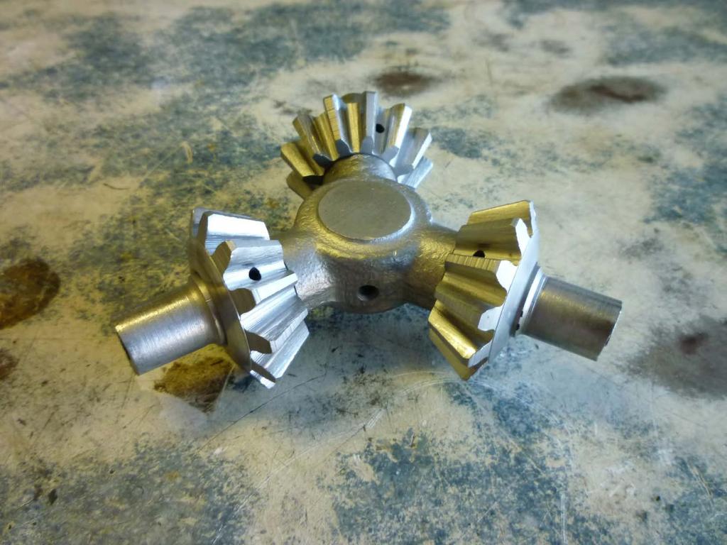 The spider gear assembly has been cleaned, inspected, and bead blasted. This particular set is a 1931 gear assembly with oil holes drilled into the three spider gears.