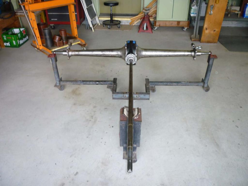 The completed axle assembly is shown horizontal roll around cradle.