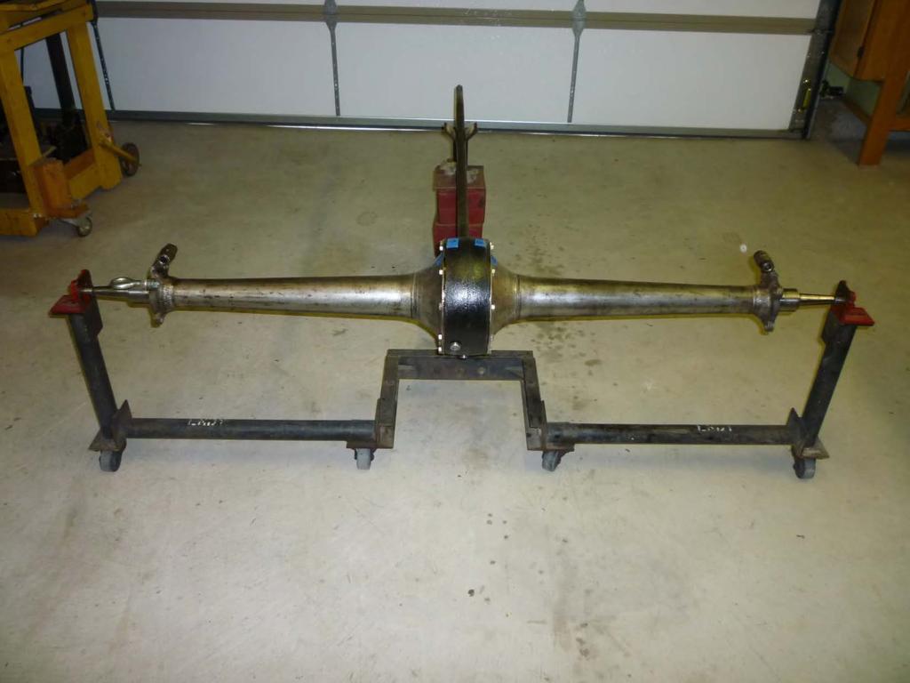 This photo shows the rear view of the axle assembly in the horizontal roll around cradle. Note the U-shape portion directly under the banjo.