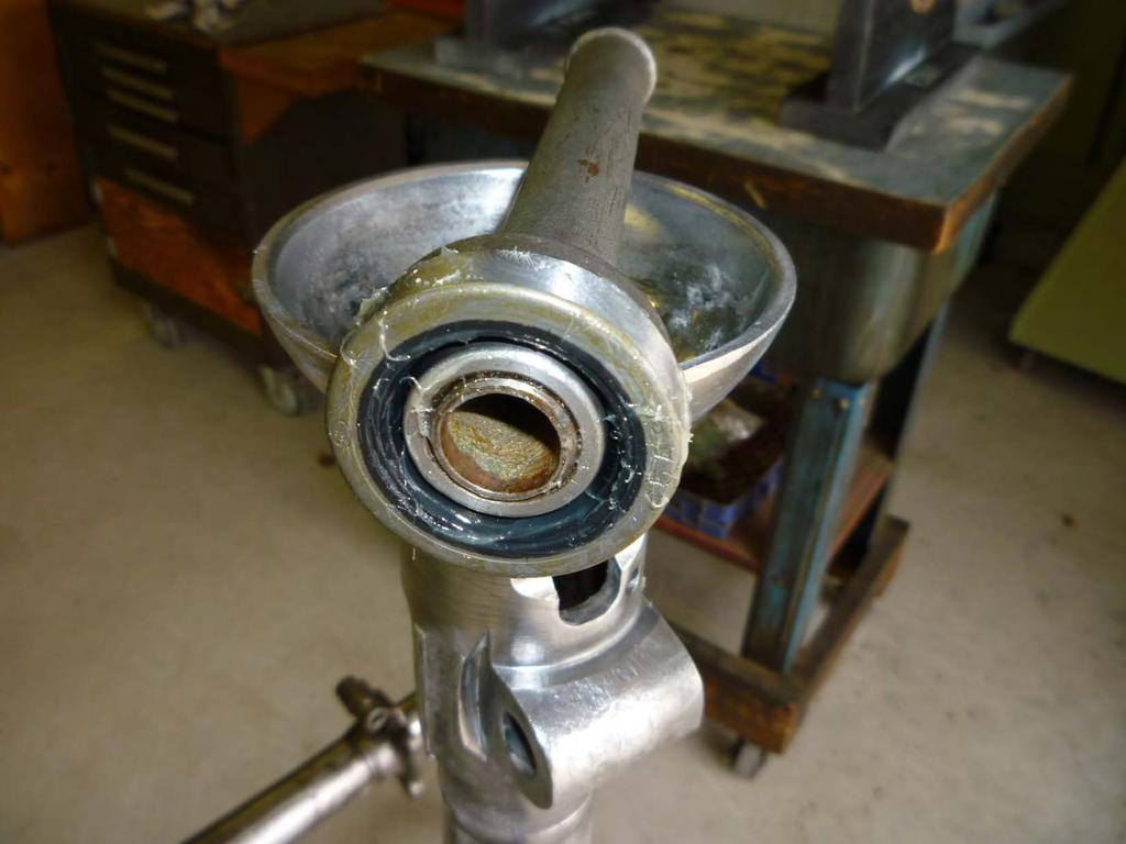 A new grease seal is installed into the front of the torque tube before the roller bearing race is installed.