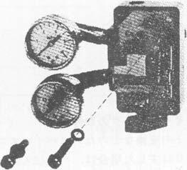 hex-hole head) with a hex wrench (5 mm). The positioner is now ready for removal. (See Figure 4-14.