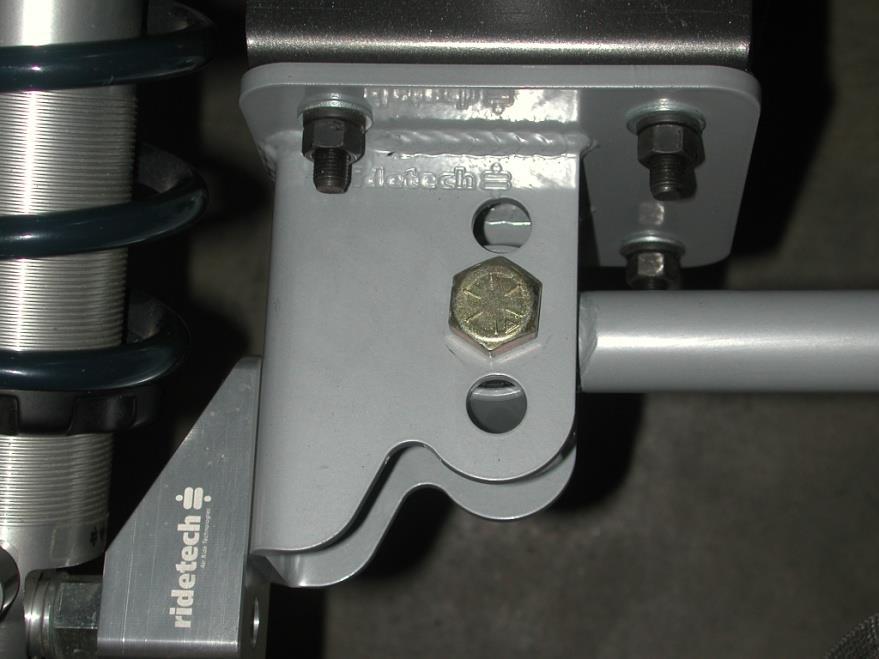 Bolt the lower Shockwave mount to the lower holes of the axle bracket if you have a monoleaf car. If you have a multileaf car the bottom of the billet mount will be flush with the axle bracket. 11.