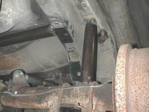16. One helpful trick to help maintain ride height and pinion angle while adjusting is to tack weld a spacer between the axle and the outside of the frame as shown in the picture.