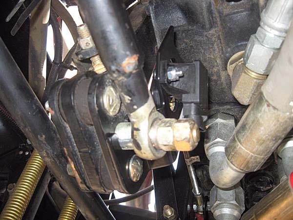 Verify the pump hose and fittings do not interfere with the sensor when the Pintle Arms move as shown in Figure 2-12.