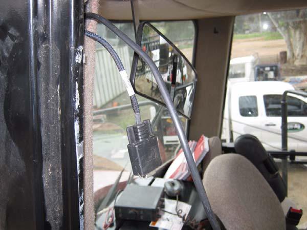 Route the LAN and 9-pin DGPS connectors straight through the pillar and into the cab via the hole at