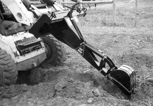 10. Lower the loader to move the backhoe closer to the ground. Fig. 10 STARTING/STOPPING 11. Starting: a. Start the skid steer engine (refer to skid steer manual). b. Turn on hydraulic circuit to provide oil to the bucket cylinder.