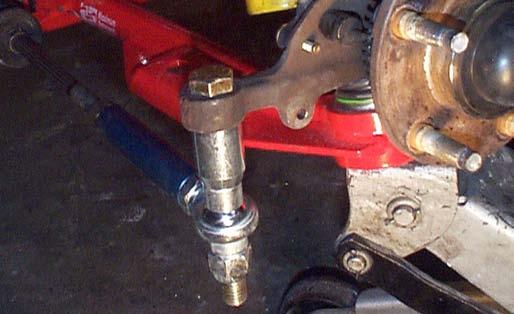 104. Attach the adjustable outer tie-rod end to the spindle. As a starting point, place a 2 stack-up of spacers between the spindle and the tie-rod end.