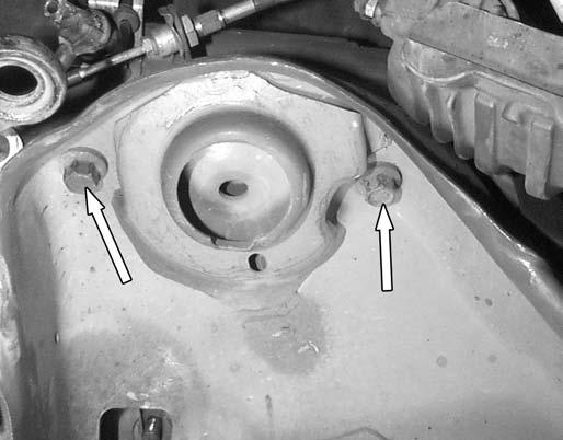 36. Loosen, but do not remove the four bolts that hold the K-member to the frame near the upper spring perches. 40.