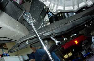 Step 7-B: Remove the center support bolt for the rear motor