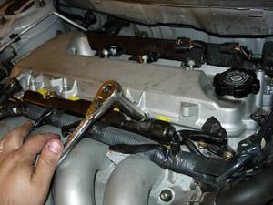 Step 9 Turbo Installation (cont): Step 9-F: Remove the 2 12MM bolts securing the fuel rail Use 12MM socket and ratchet.