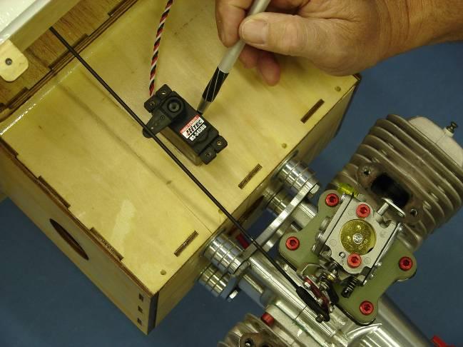 Use a rotary cutting tool to cut out the throttle servo mounting hole.