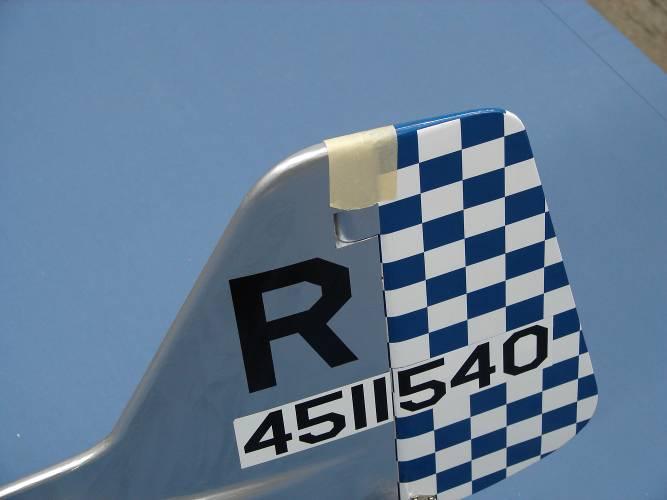 11. Tape the rudder to the top edge of the vertical fin in the neutral