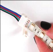 Locate the cut line on the RGB+WW LED strip (RGB version strip shown in photos). 2. Using only sharp scissors, cut evenly across the solder pads at an exact angle 90 degrees to the LED strip.