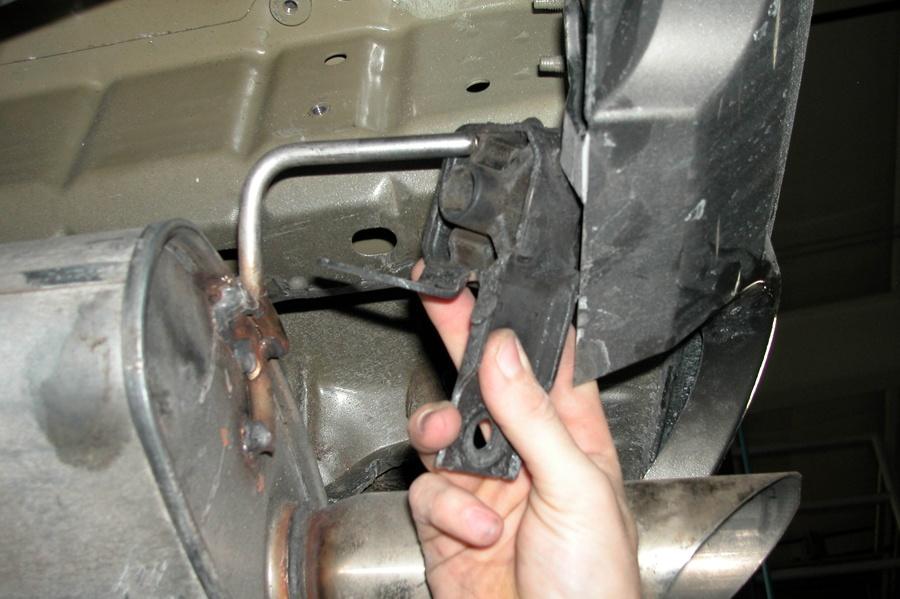rear most rubber isolator above the passenger side muffler (See Fig. D). 5.