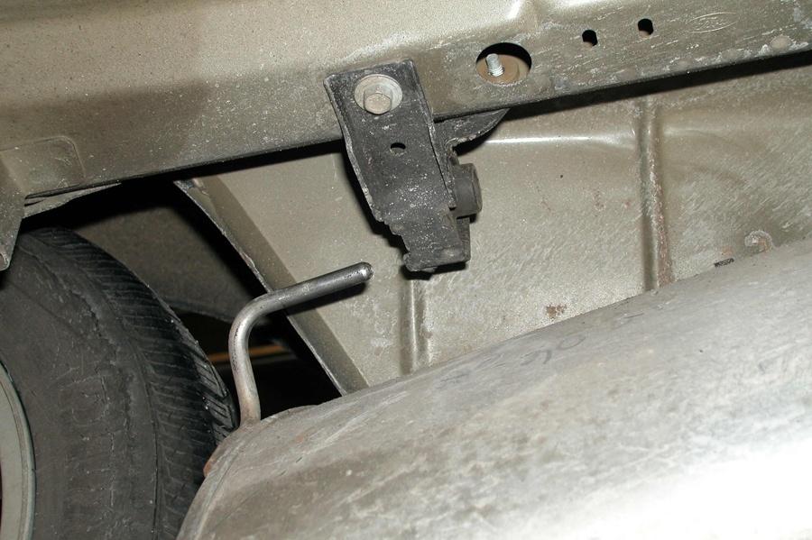 6. Slide the passenger side muffler off of the over the axle pipe (See Fig. F). 7.