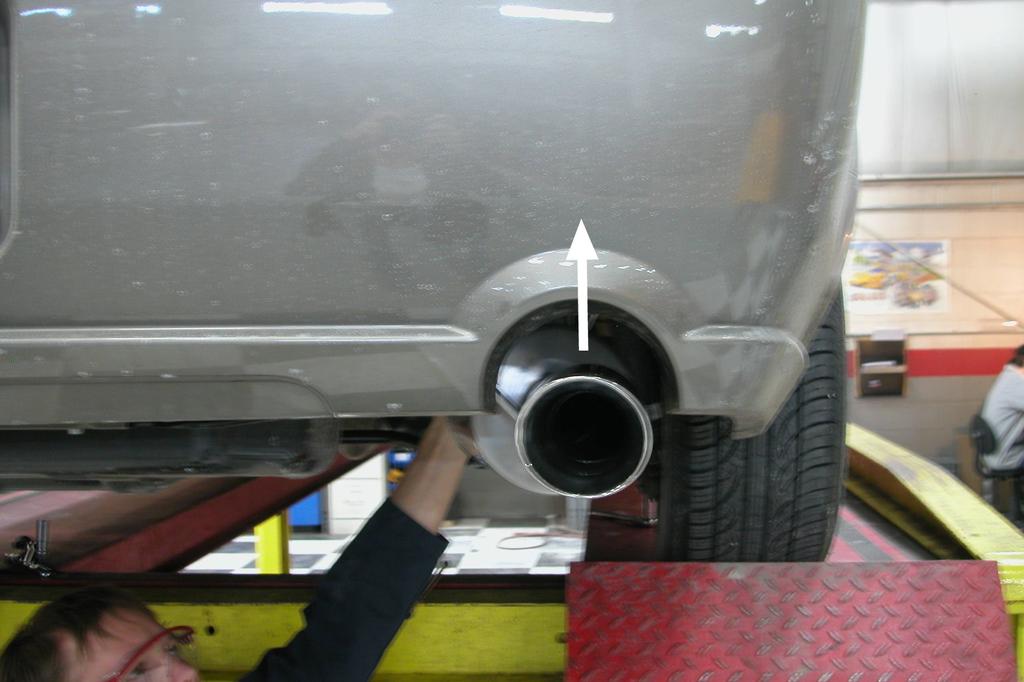 Using all three of these adjustments the exhaust system will be able to be completely centered in the bumper cut-outs (see Fig. R). Adjustment Photos FIG. N FIG. P FIG.