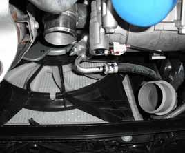 Step 10: Remove the 2 clamps securing the intercooler tube to the turbo and